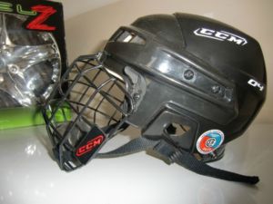 Brand new child's CCM hockey helmet with cage - HECC certified