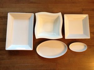 Collection of pristine white ceramic serving dishes/trays