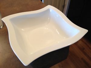 Collection of pristine white ceramic serving dishes/trays